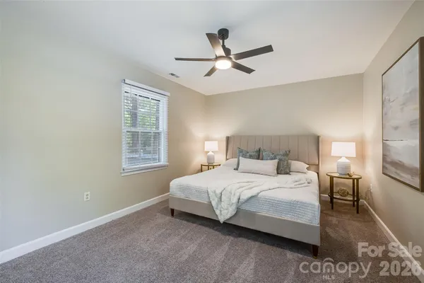 a bedroom with a bed and window