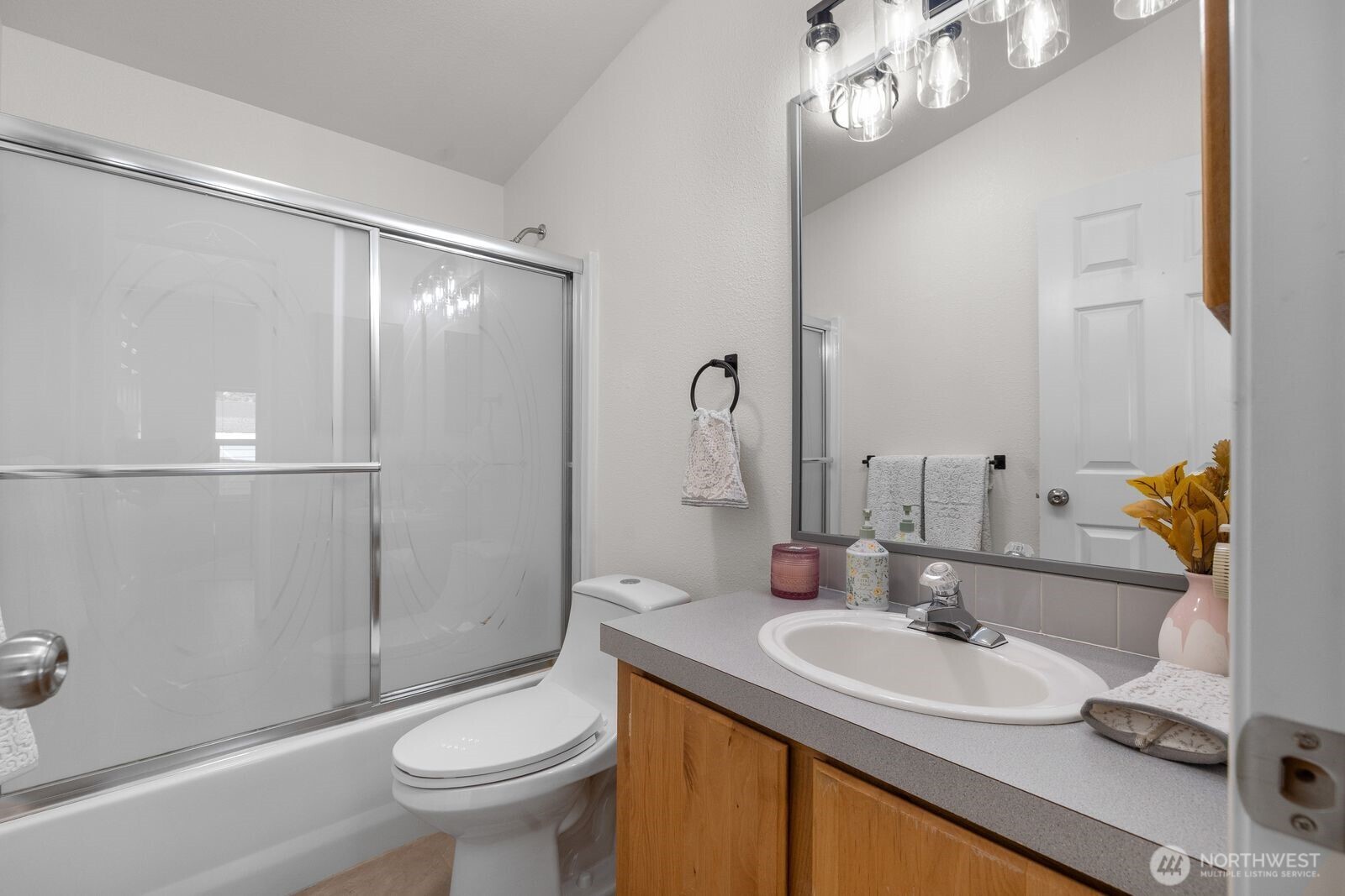 23825 15th Avenue Southeast, Unit 311 Bothell, WA 98021 - Photo 12 of 24 a bathroom with a sink toilet and shower