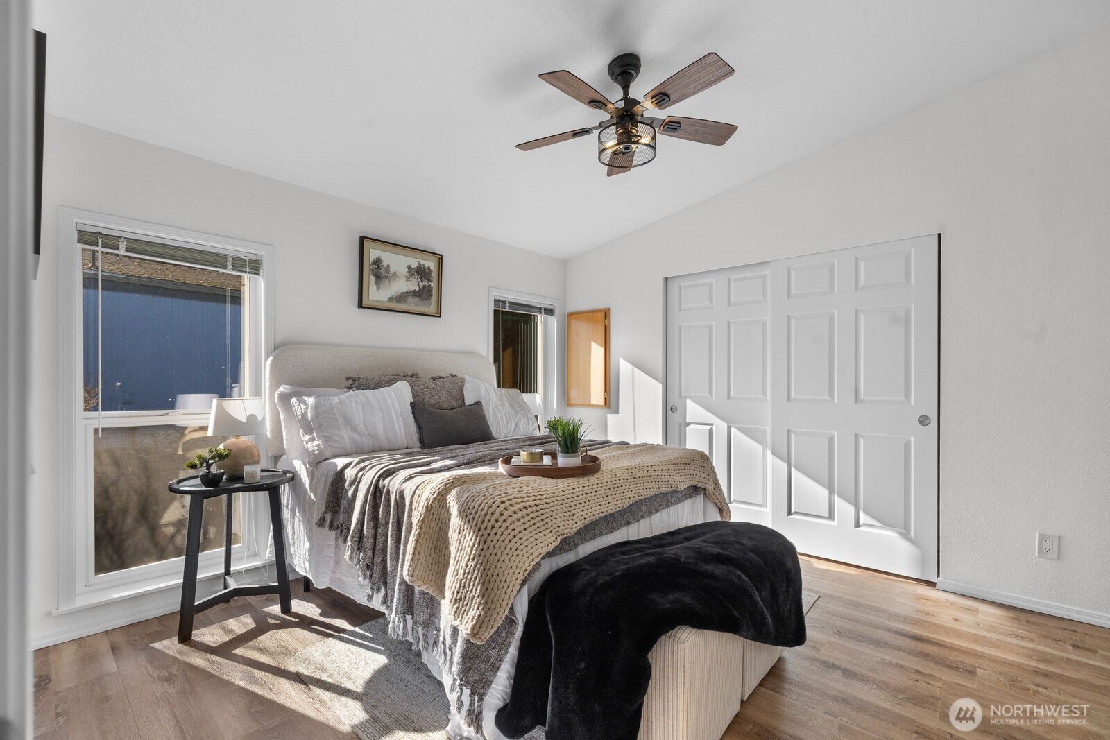 23825 15th Avenue Southeast, Unit 311 Bothell, WA 98021 - Photo 16 of 24 a bedroom with a bed and a chandelier