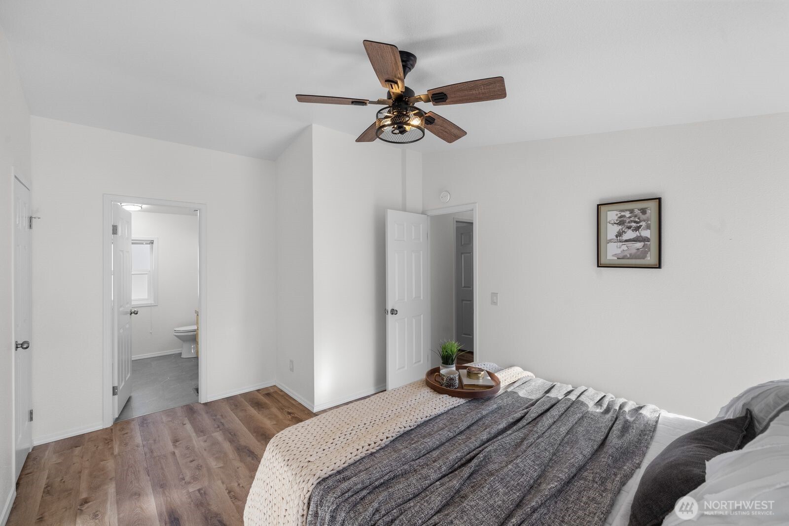 23825 15th Avenue Southeast, Unit 311 Bothell, WA 98021 - Photo 17 of 24 a bedroom with a bed and a chandelier