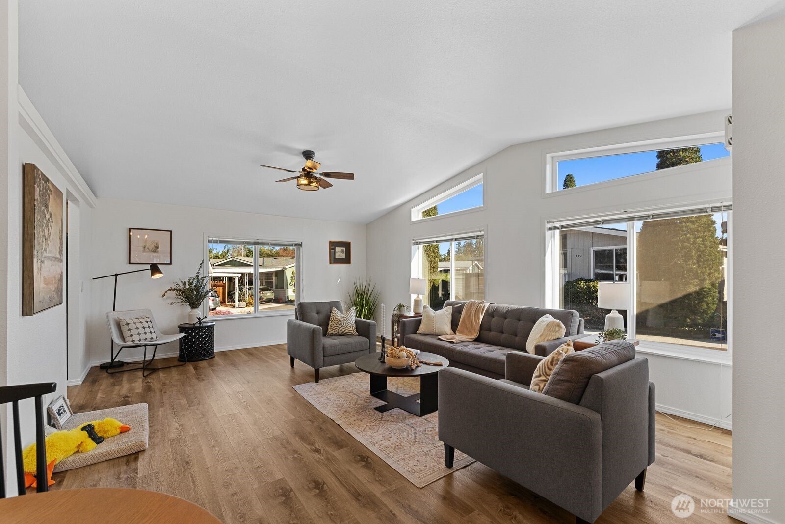23825 15th Avenue Southeast, Unit 311 Bothell, WA 98021 - Photo 5 of 24 a living room with furniture and a wooden floor