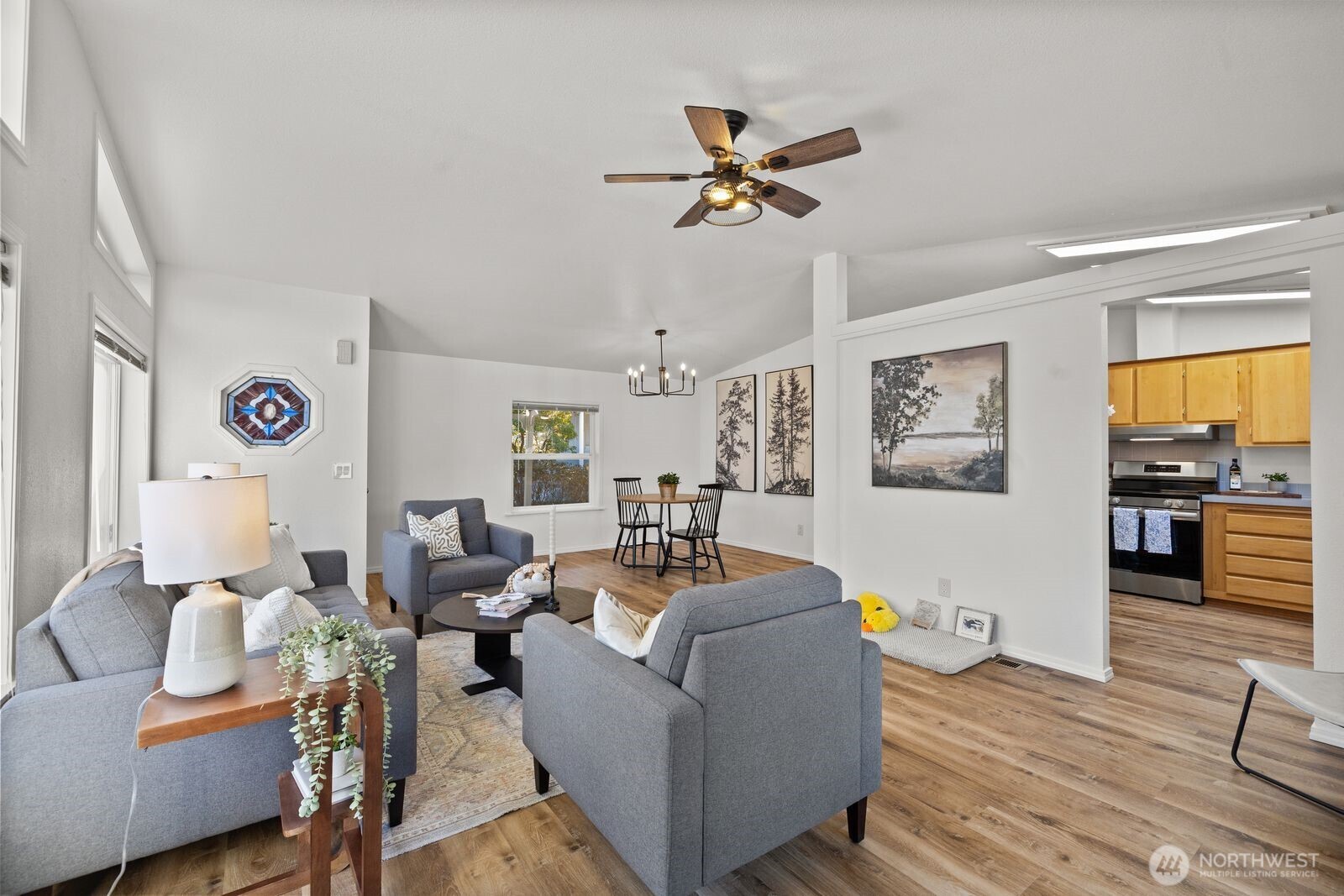 23825 15th Avenue Southeast, Unit 311 Bothell, WA 98021 - Photo 8 of 24 a living room with furniture and wooden floor