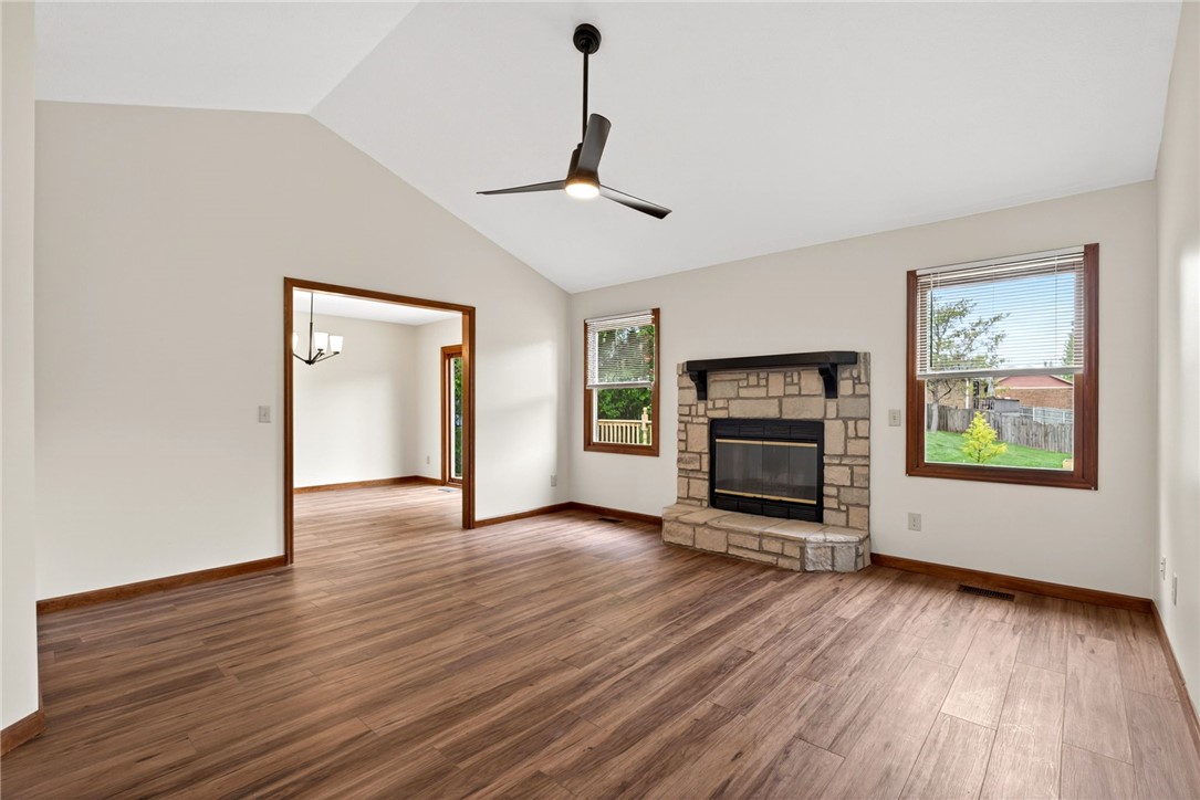 862 Camp Creek Road Waynesville, OH 45068 - Photo 6 of 44 This inviting living area features warm wood flooring, a charming fireplace, and a vaulted ceiling.