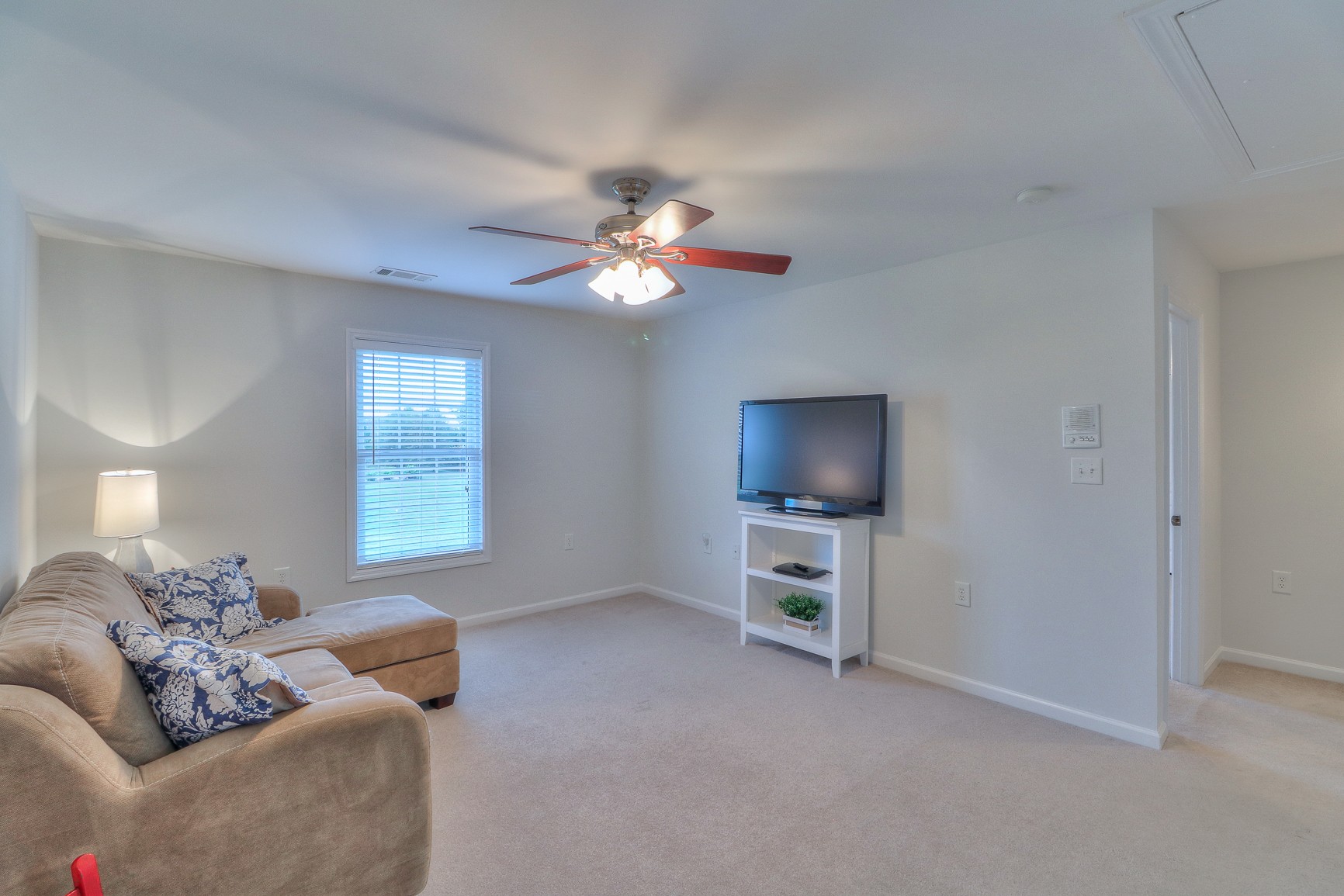 5009 Ash Hill Road Spring Hill, TN 37174 - Photo 36 of 56 a living room with furniture and a ceiling fan