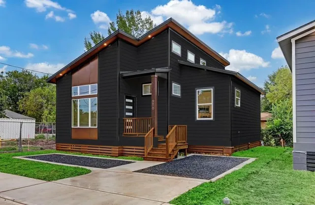 a front view of a house with garden