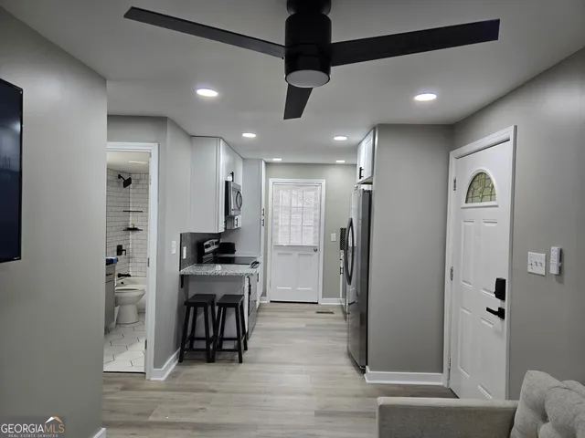 a kitchen with a stove and a microwave