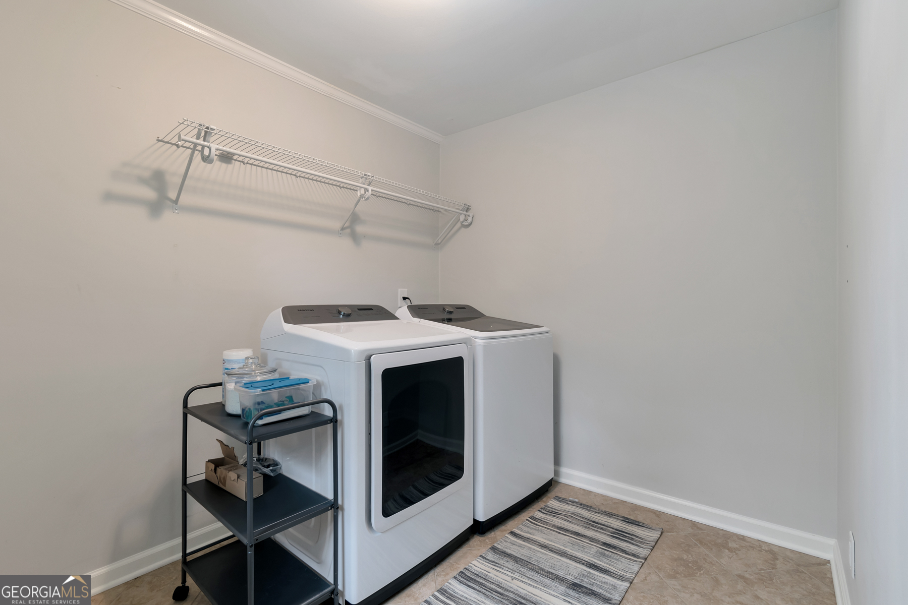 1897 Mt Vernon Road Dunwoody, GA 30338 - Photo 13 of 40 a utility room with dryer and washer
