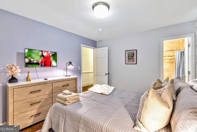 a bedroom with a bed and a dresser