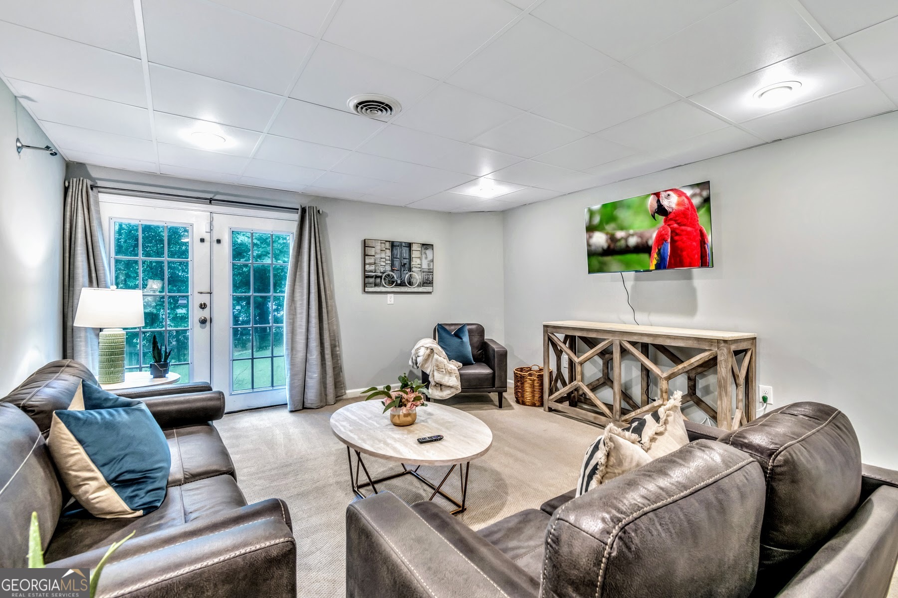 1897 Mt Vernon Road Dunwoody, GA 30338 - Photo 29 of 40 a bedroom with furniture and a large window