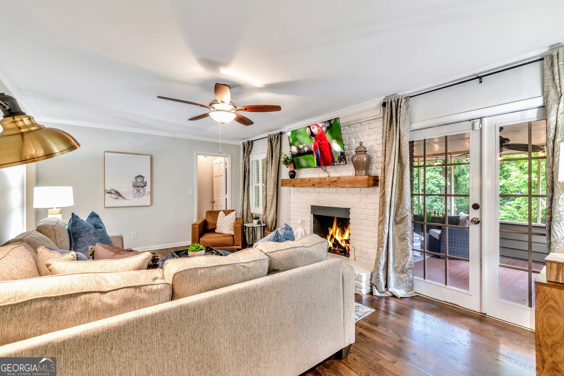 1897 Mt Vernon Road Dunwoody, GA 30338 - Photo 3 of 40 a living room with furniture a fireplace and a flat screen tv