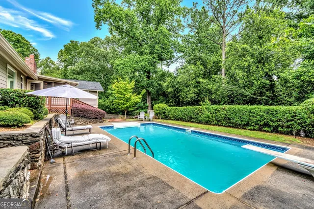 a view of a swimming pool with lounge chair