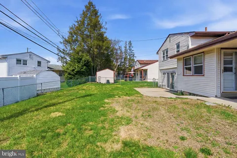 a front view of house with garden