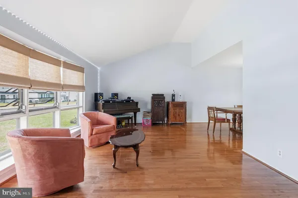a view of a livingroom with wooden floor