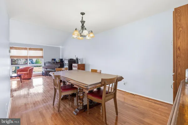 a kitchen with stainless steel appliances granite countertop a stove a refrigerator and a microwave