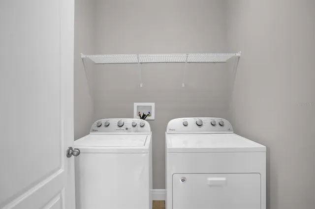 a utility room with dryer and washer