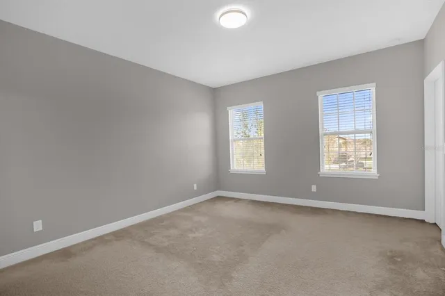 an empty room with windows