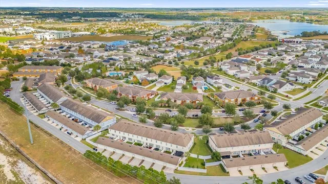 an aerial view of residential building and lake