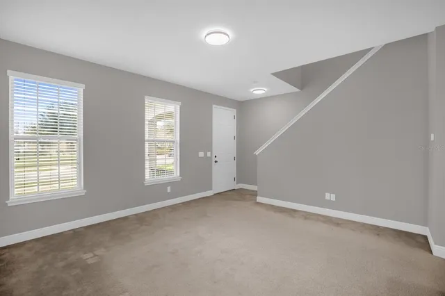 a view of an empty room with a window