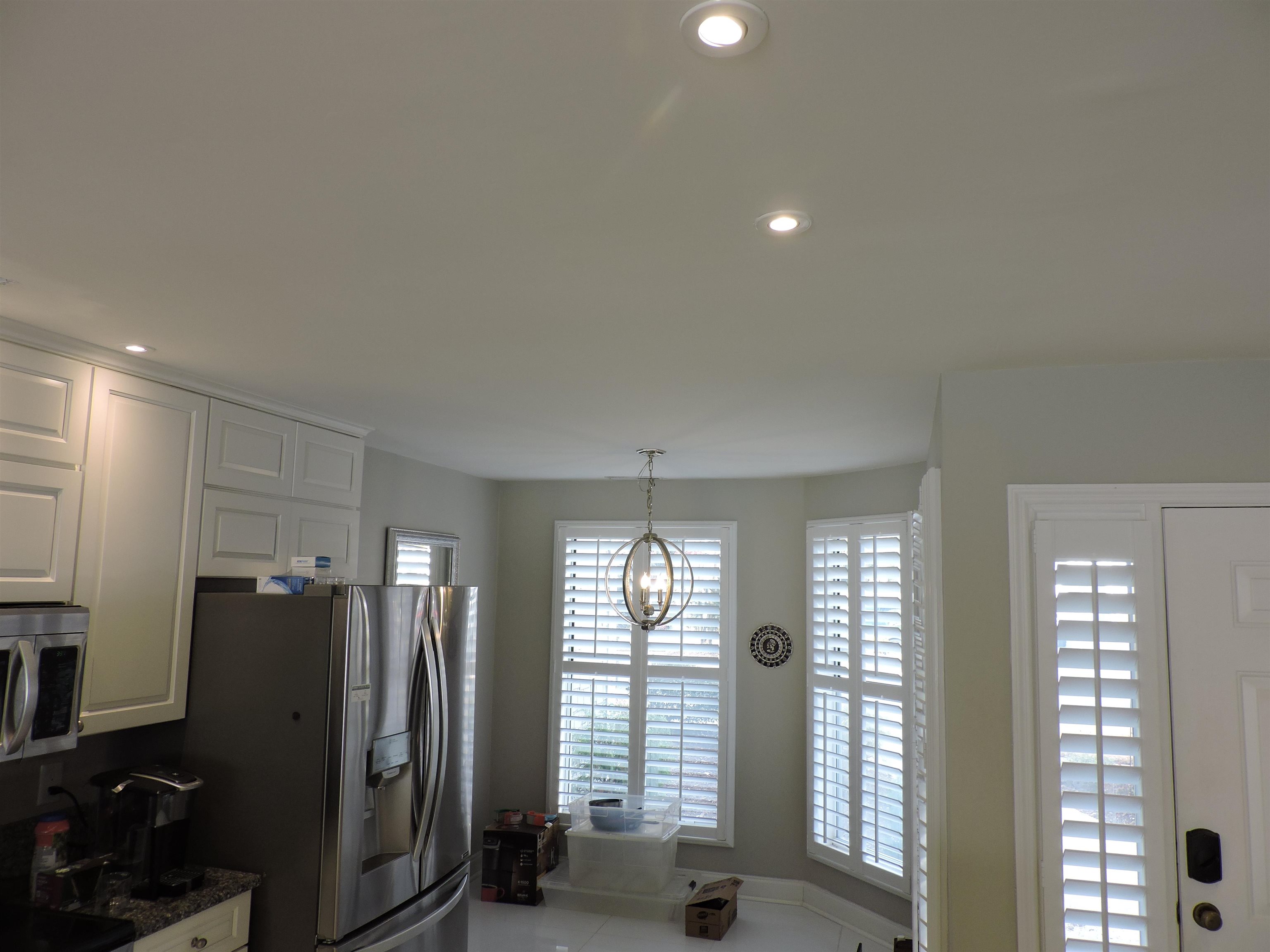 4396 Baldwin Avenue, Unit 80 Little River, SC 29566 - Photo 13 of 40 Kitchen featuring white cabinetry, stainless steel appliances, decorative light fixtures, dark stone countertops, and recessed lighting