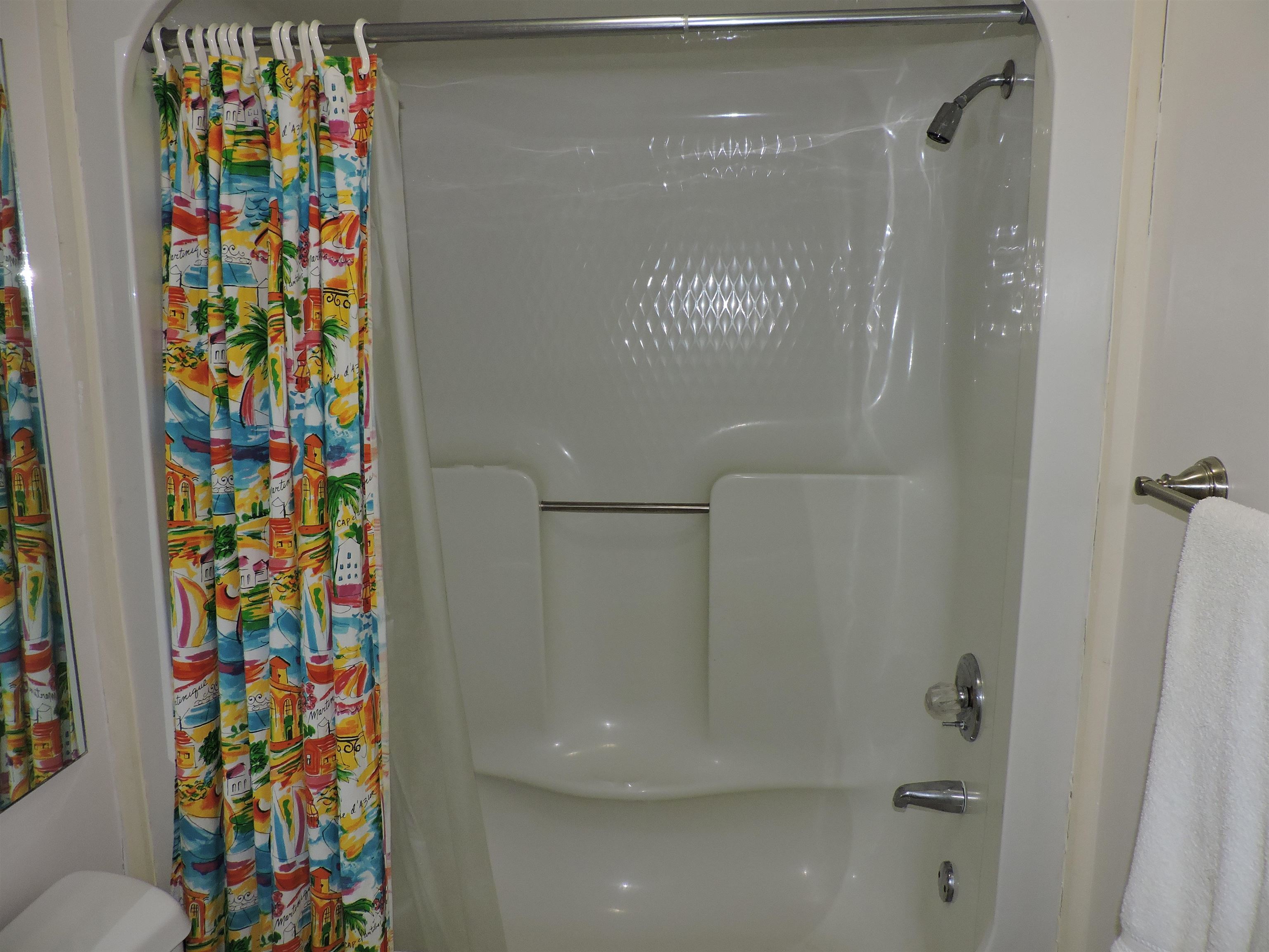 4396 Baldwin Avenue, Unit 80 Little River, SC 29566 - Photo 19 of 40 Full bathroom featuring toilet and shower / tub combo with curtain