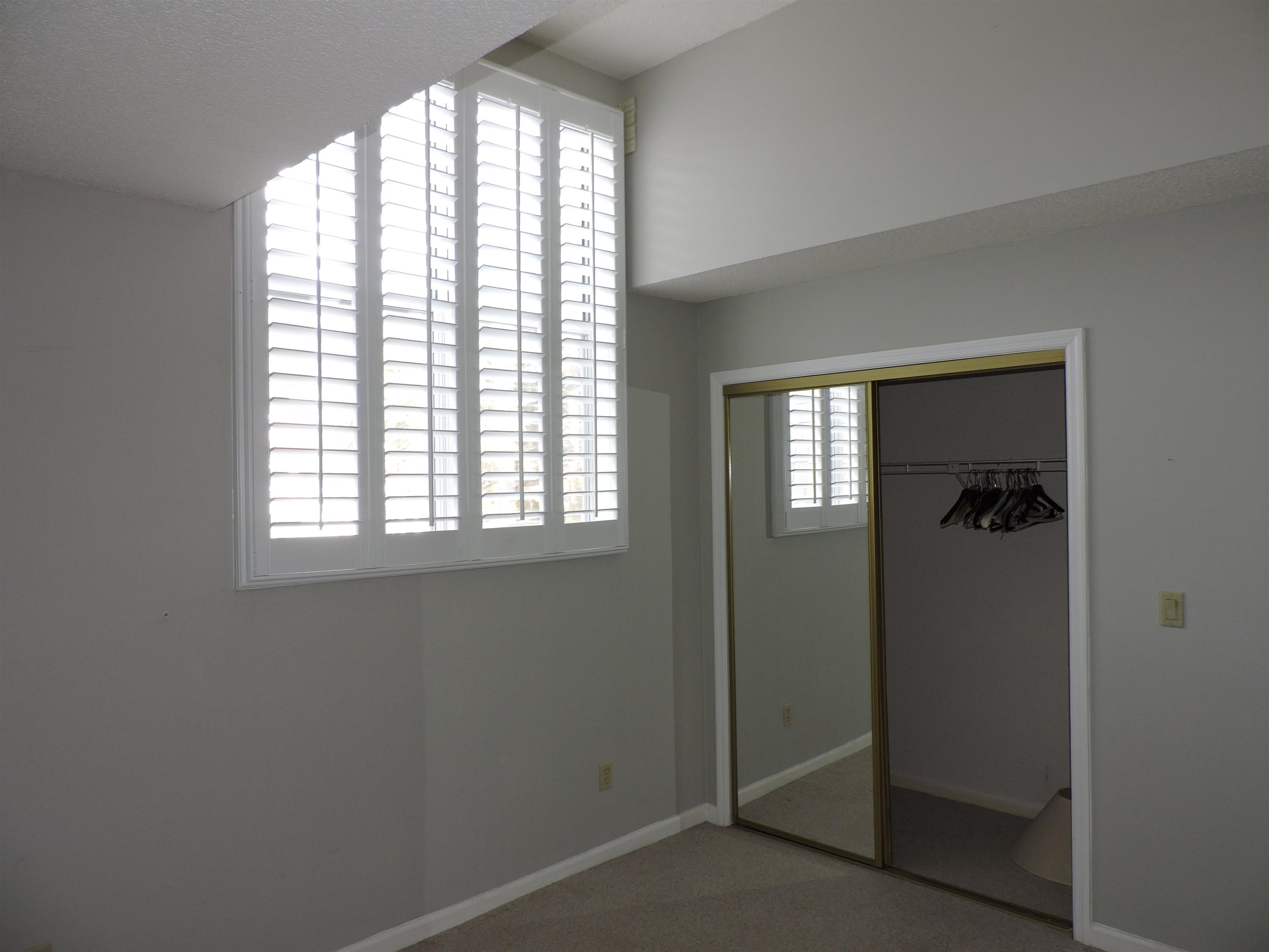 4396 Baldwin Avenue, Unit 80 Little River, SC 29566 - Photo 20 of 40 Unfurnished bedroom featuring a closet and light colored carpet