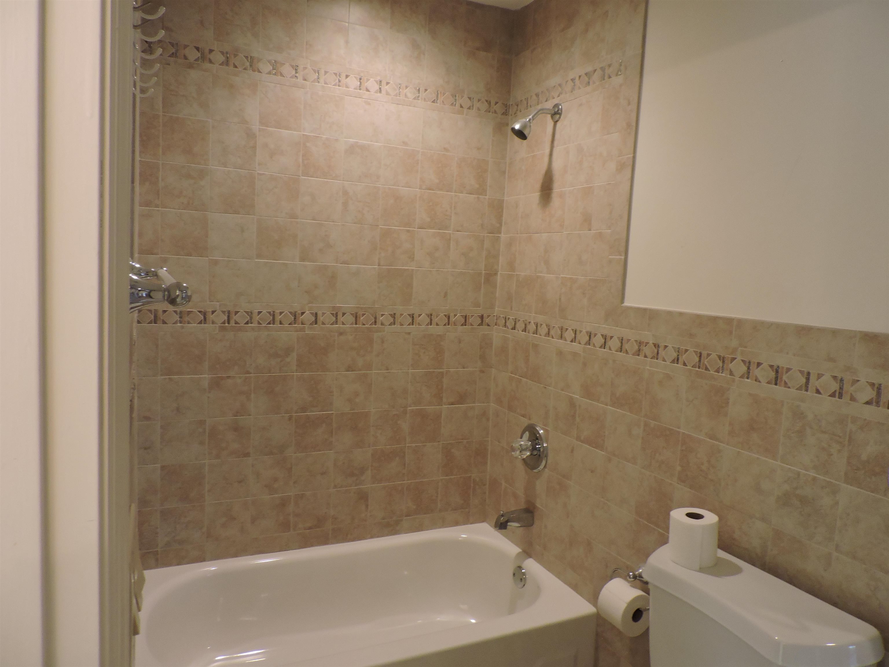 4396 Baldwin Avenue, Unit 80 Little River, SC 29566 - Photo 26 of 40 Full bath featuring washtub / shower combination and tile walls