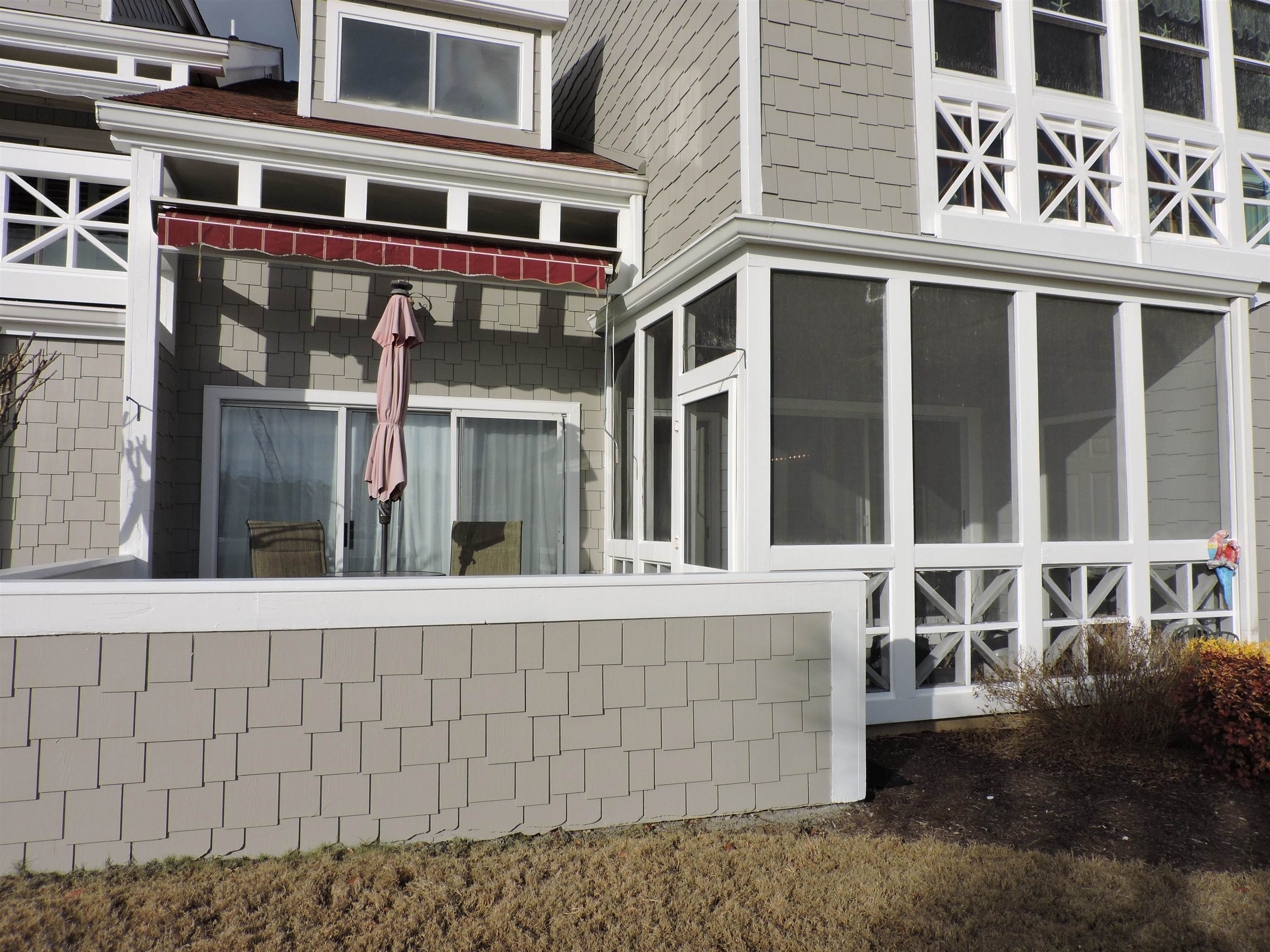 4396 Baldwin Avenue, Unit 80 Little River, SC 29566 - Photo 34 of 40 View of side of property featuring a sunroom