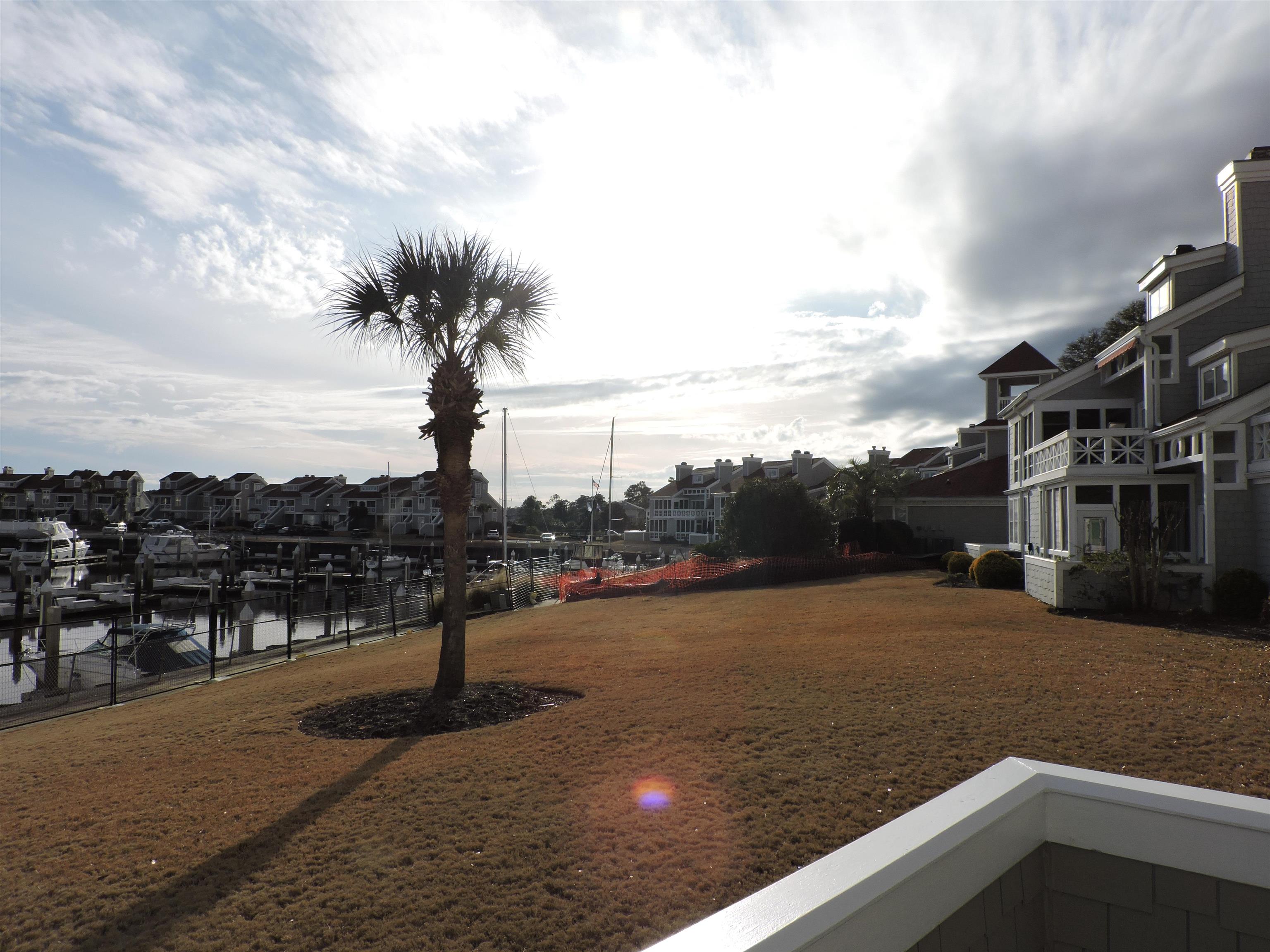 4396 Baldwin Avenue, Unit 80 Little River, SC 29566 - Photo 39 of 40 View of yard with a residential view, a water view, and a boat dock