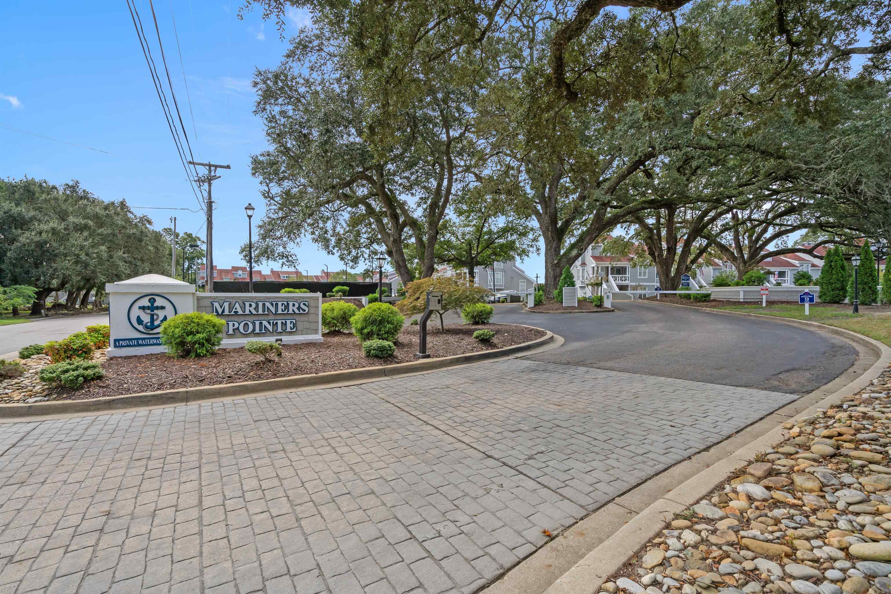 4396 Baldwin Avenue, Unit 80 Little River, SC 29566 - Photo 7 of 40 View of road featuring curbs and street lighting