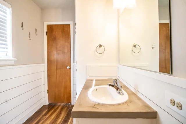 a bathroom with a sink and a mirror