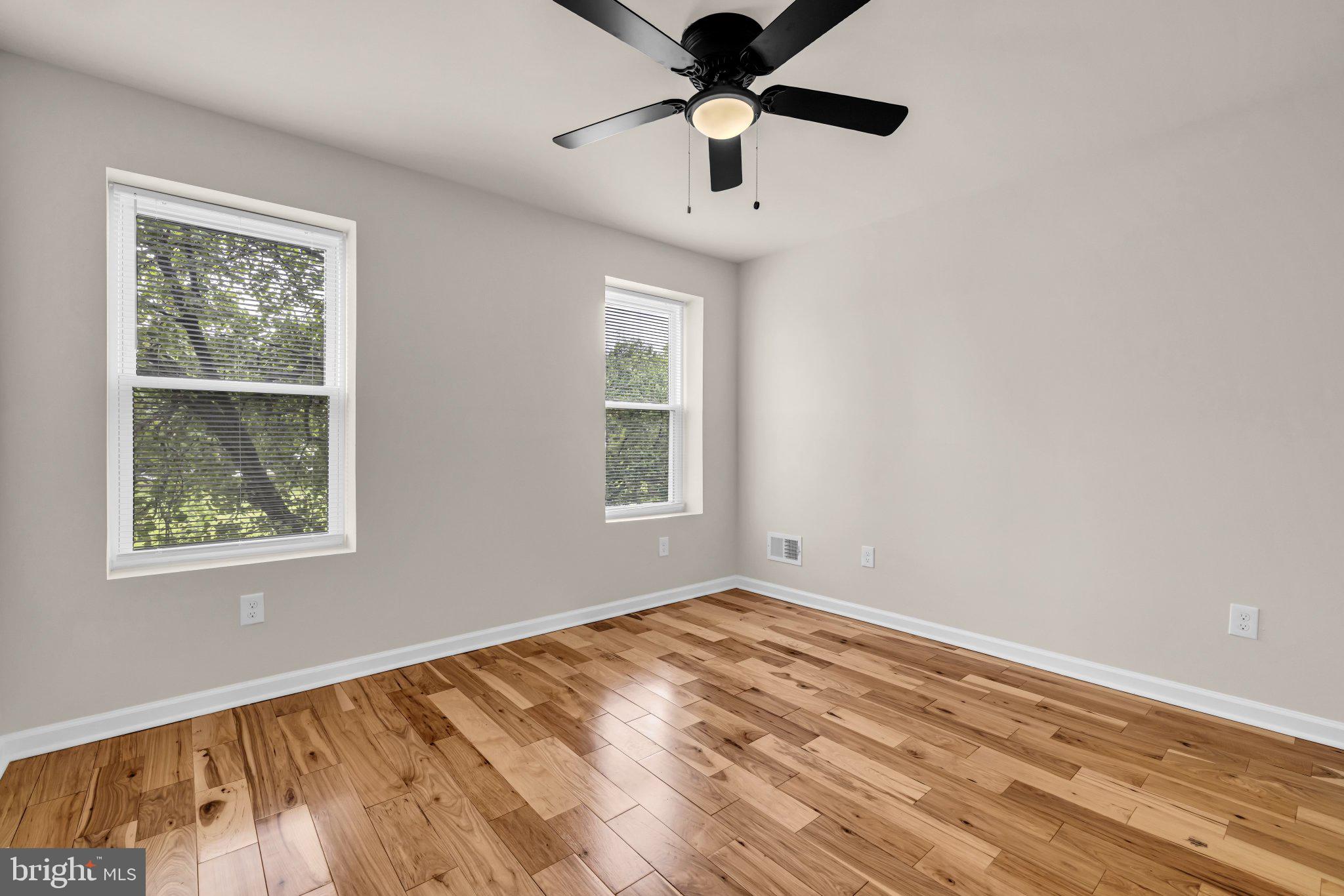 1622 Hazel Street Baltimore, MD 21226 - Photo 16 of 40 Bright and airy room with wood floors.