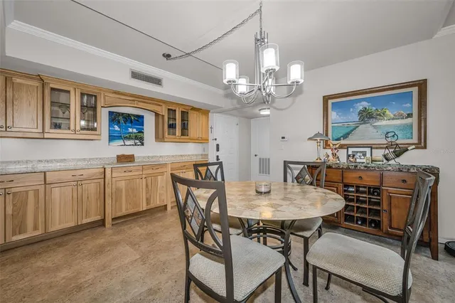 a kitchen with granite countertop cabinets stainless steel appliances and a sink