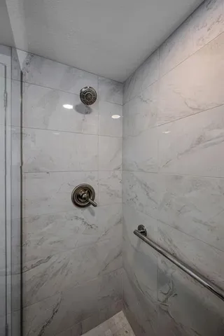 a bed room with a bed and a television