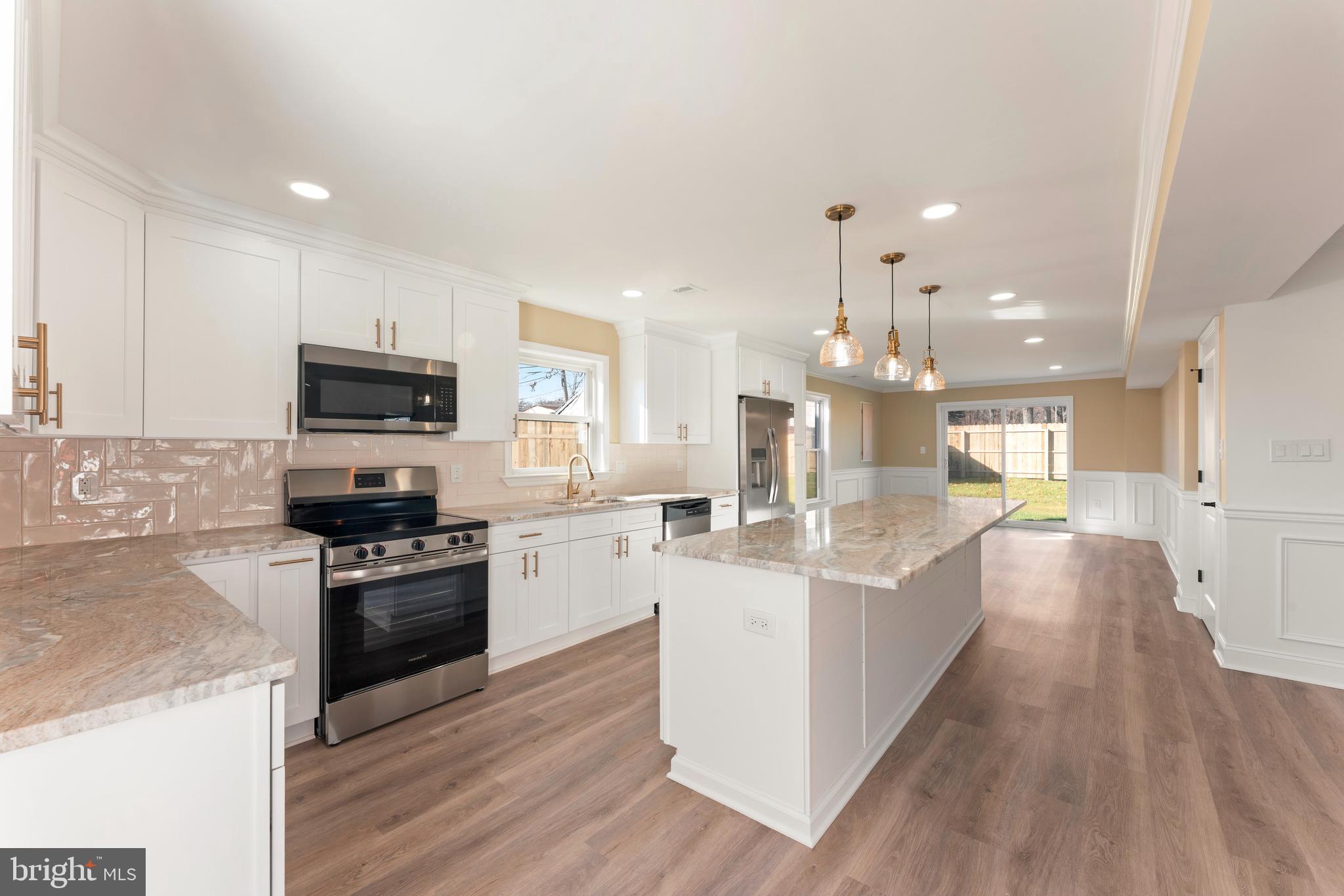 43 Petunia Road Levittown, PA 19056 - Photo 12 of 35 a large kitchen with granite countertop a large counter top appliances and cabinets