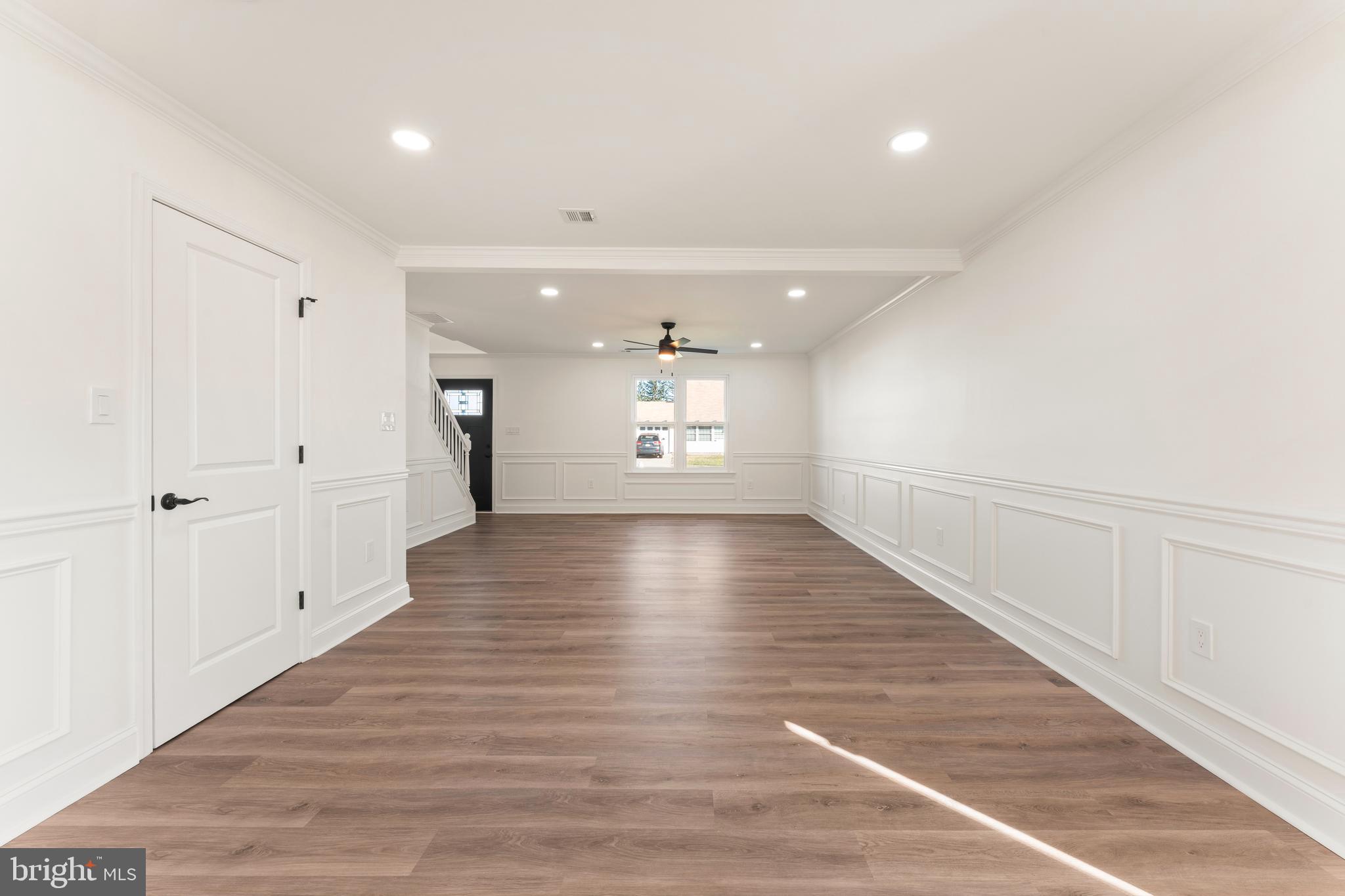 43 Petunia Road Levittown, PA 19056 - Photo 5 of 35 a view of an empty room with wooden floor and a window