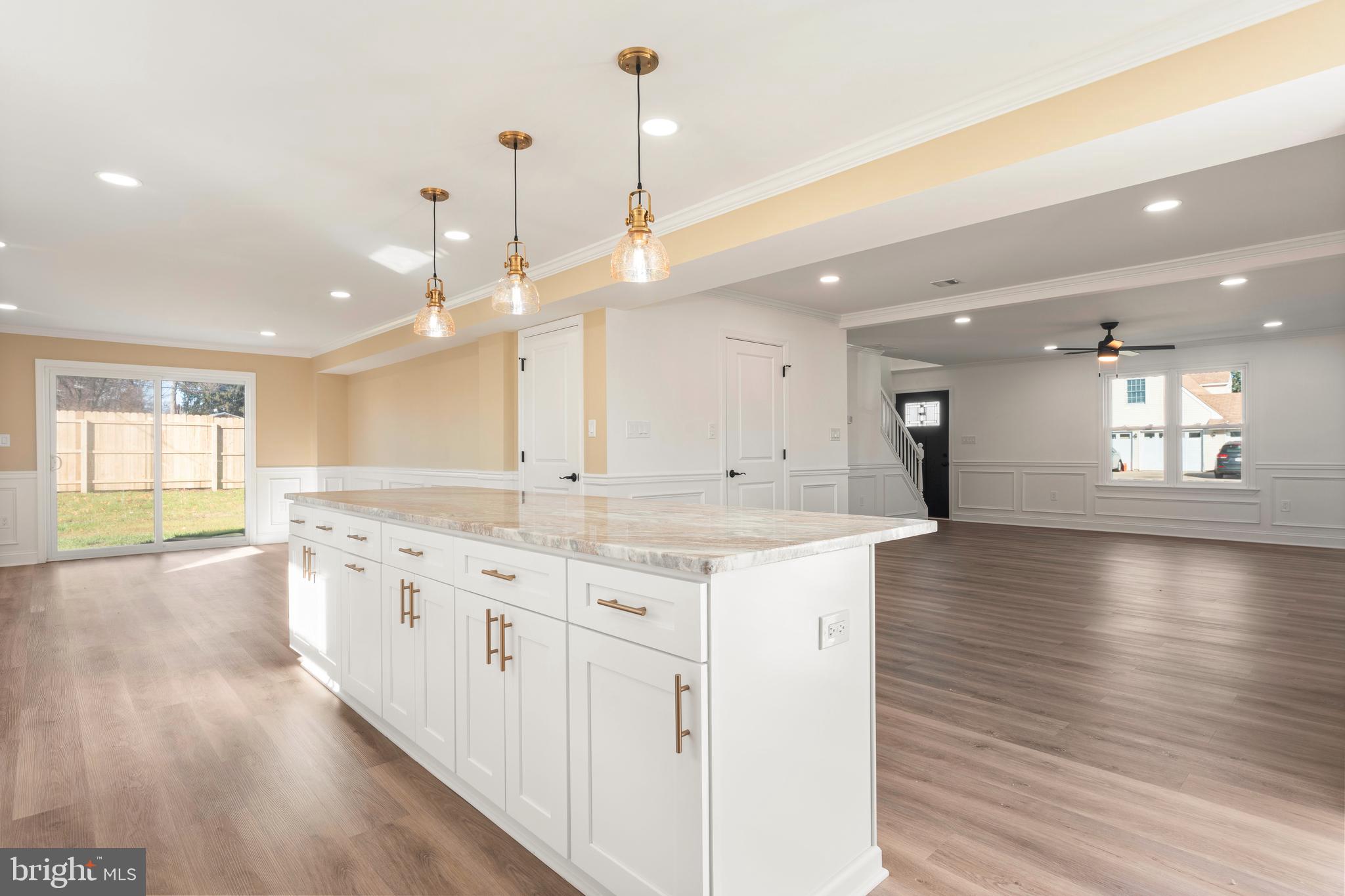 43 Petunia Road Levittown, PA 19056 - Photo 10 of 35 a large kitchen with granite countertop a large kitchen island and a sink dishwasher refrigerator with wooden floor
