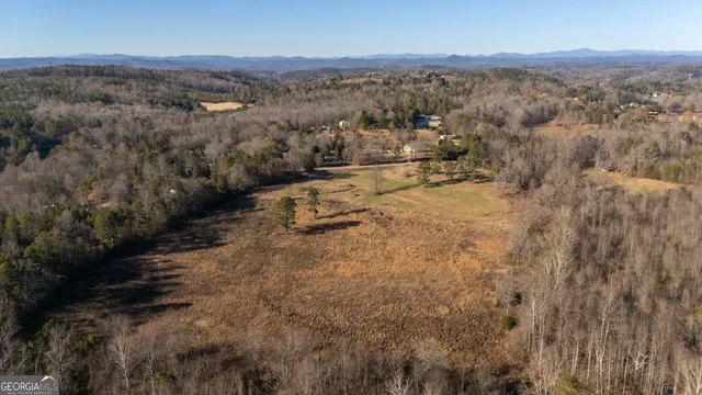 an aerial view of residential house with parking space