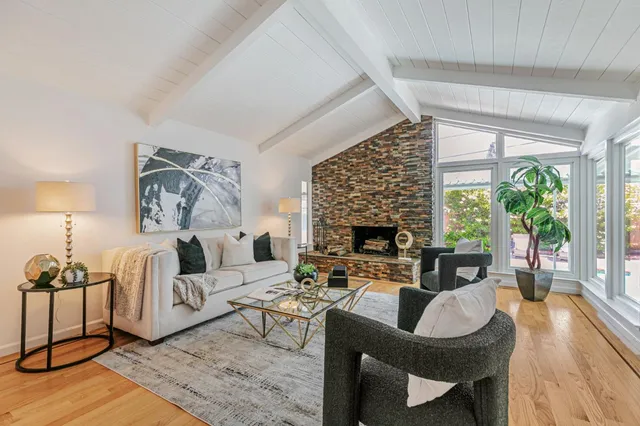 a living room with furniture and a table