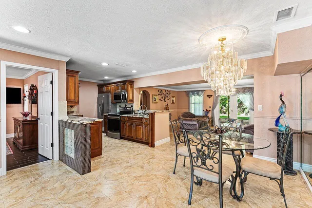 a kitchen with a table and chairs in it
