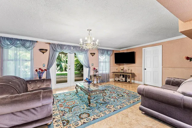 a living room with fireplace furniture and a flat screen tv