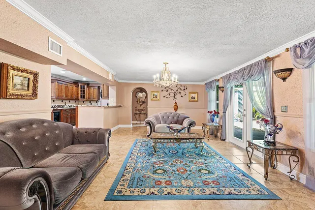 a living room with furniture and a rug