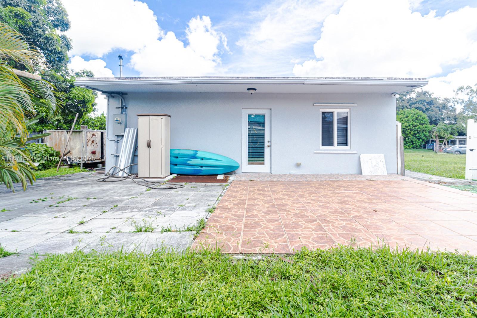 15600 Northwest 157th St Road Miami Gardens, FL 33054 - Photo 11 of 25 a front view of a house with garden