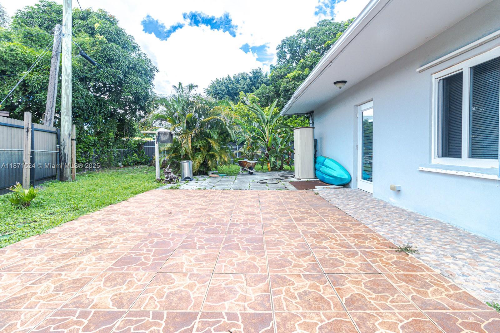 15600 Northwest 157th St Road Miami Gardens, FL 33054 - Photo 12 of 25 a view of a backyard with garden