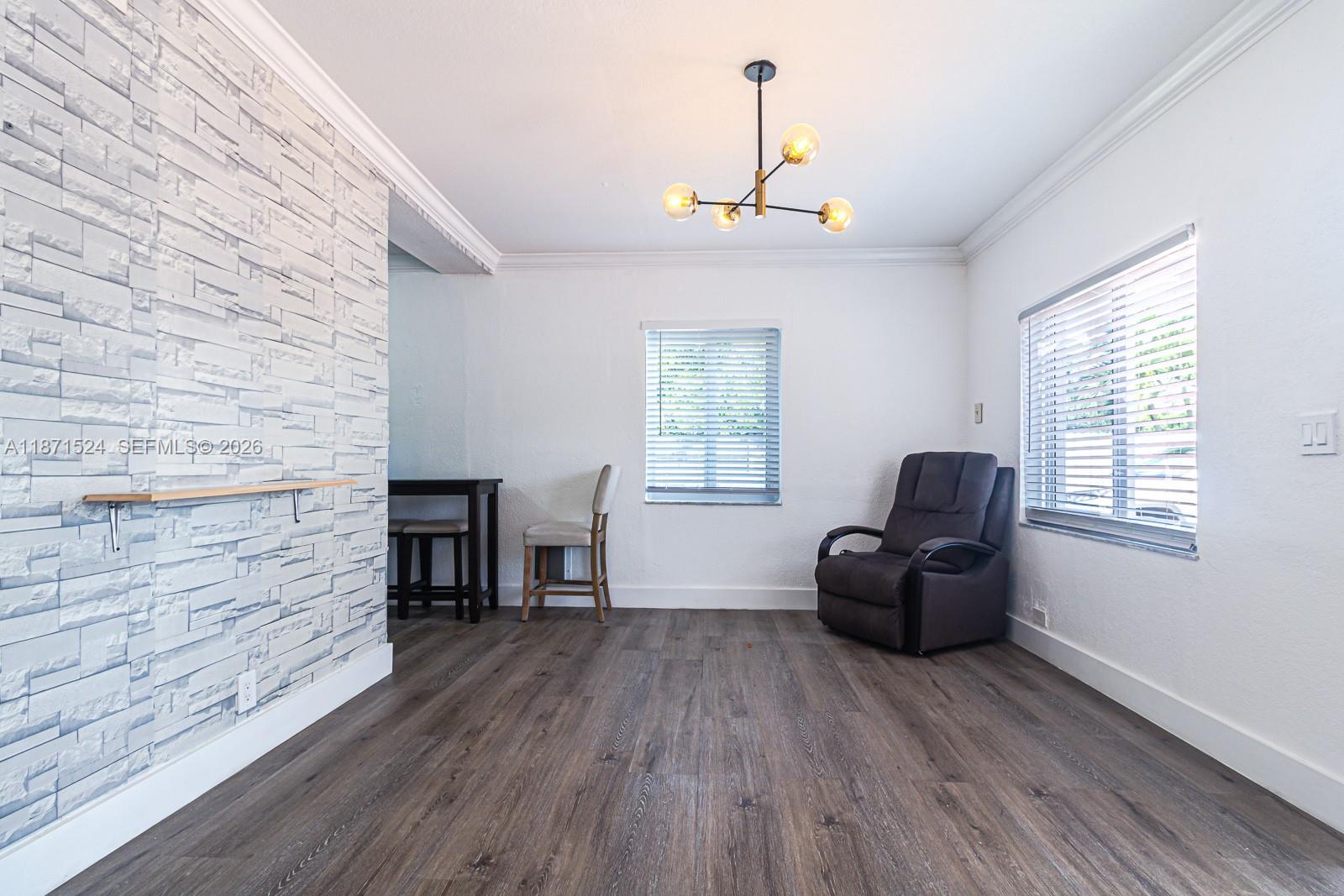 15600 Northwest 157th St Road Miami Gardens, FL 33054 - Photo 17 of 21 a living room with furniture and a wooden floor