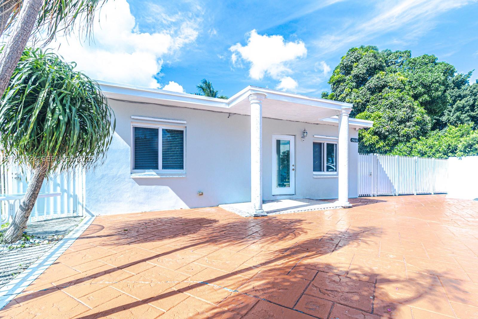 15600 Northwest 157th St Road Miami Gardens, FL 33054 - Photo 2 of 21 a view of a backyard of the house