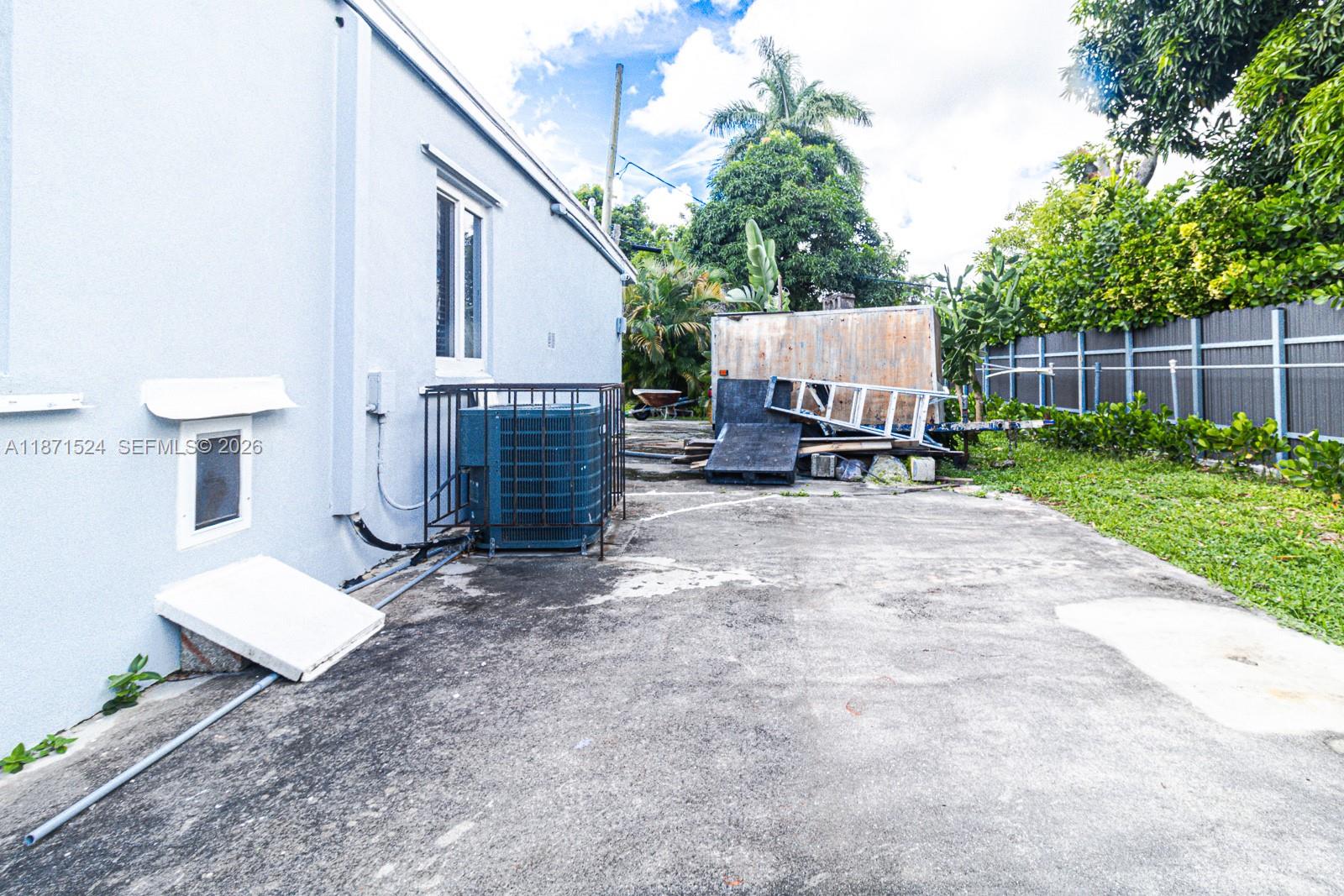 15600 Northwest 157th St Road Miami Gardens, FL 33054 - Photo 6 of 21 a view of backyard with sitting area and furniture