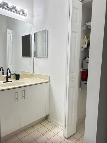 a bathroom with a sink and mirror