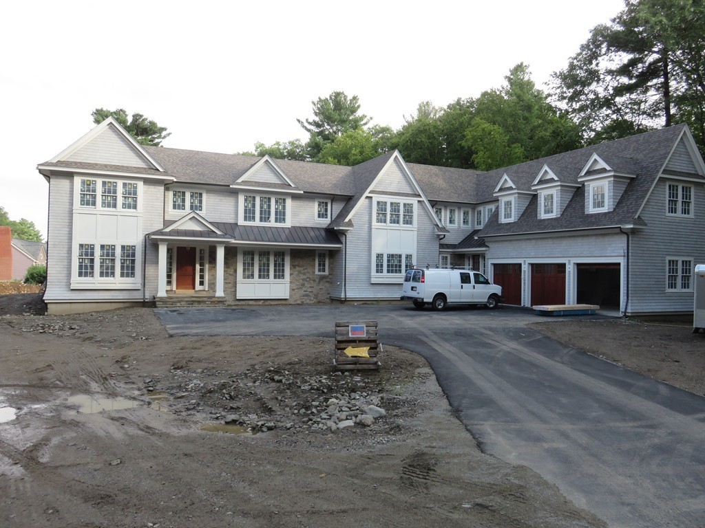 100 Ridgeway Road Weston, MA 02493 - Photo 2 of 7 a front view of a house with a yard
