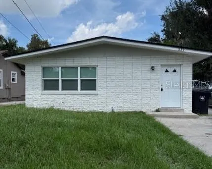 a house with garden in front of it