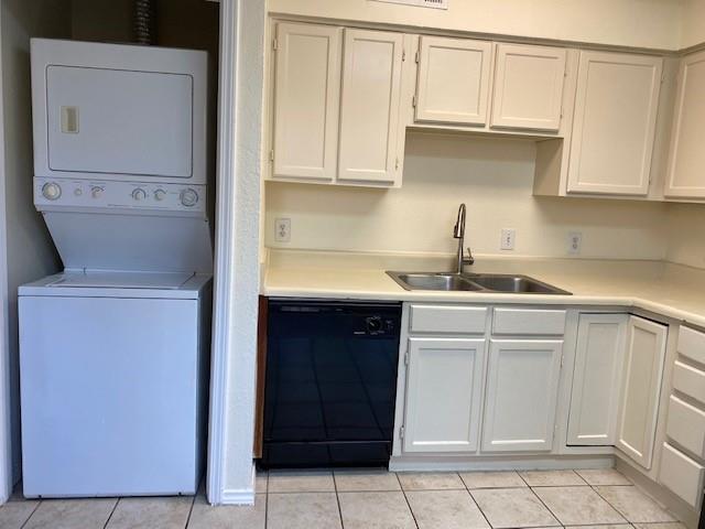 4748 Old Bent Tree Lane, Unit 803 Dallas, TX 75287 - Photo 16 of 20 a kitchen with white cabinets and white appliances